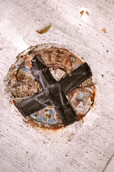 A water pipe access point taped with a Black “X” in front of Elena Bautista’s former residence.
