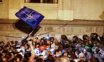 Georgian riot police block opposition party supporters during a protest against the foreign agents draft bill near the Georgian parliament in Tbilisi,