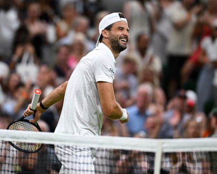 A delighted Grigor Dimitrov beams after beating Matteo Berrettini of Italy