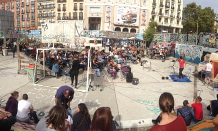 A performer entertains the outdoor crowd at El Campo de la Cebada, Madrid, Spain.