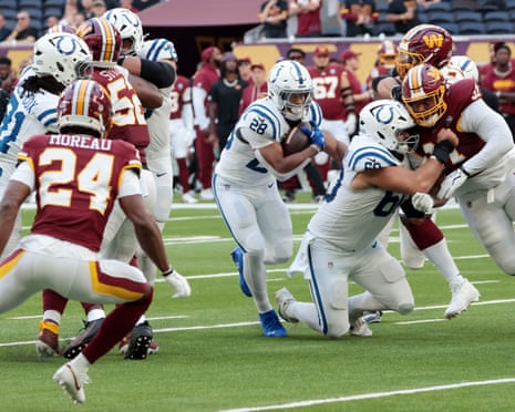 Indianapolis Coltsâ running back Jonathan Taylor runs with the football during their match against the Washington Commanders.