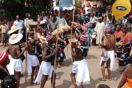 Celebrants take part in the New Yam festival with dancing and instrumentation present.