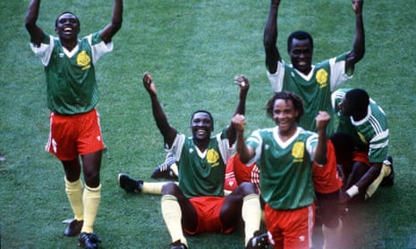 Cameroon players celebrate their goal.