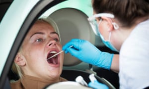A woman receives a swab test