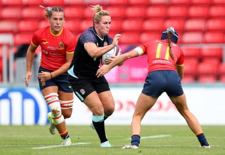 England’s captain, Marlie Packer, fends off a tackle