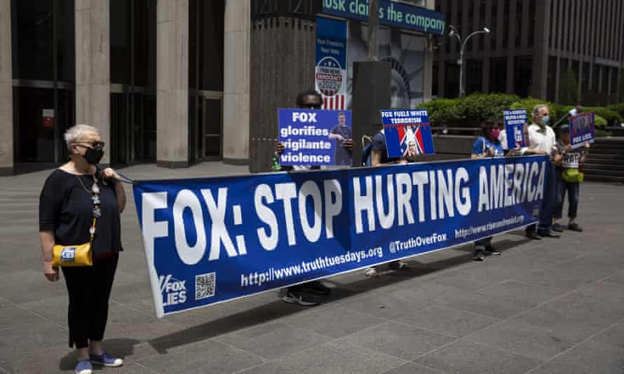 Activists hold a protest outside the Fox News studio in midtown Manhattan, denouncing the network’s push of the white supremacist ‘great replacement theory’.