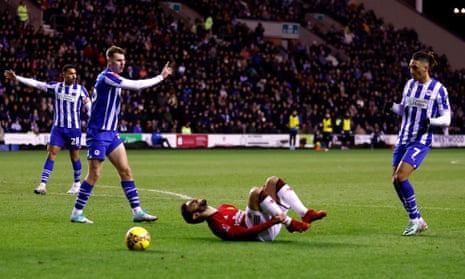 Manchester United’s Bruno Fernandes reacts after being fouled inside the box by Wigan Athletic’s Liam Shaw.