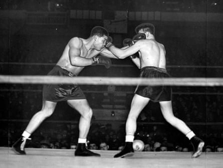 Black and white photo of Louis and McCoy in the ring