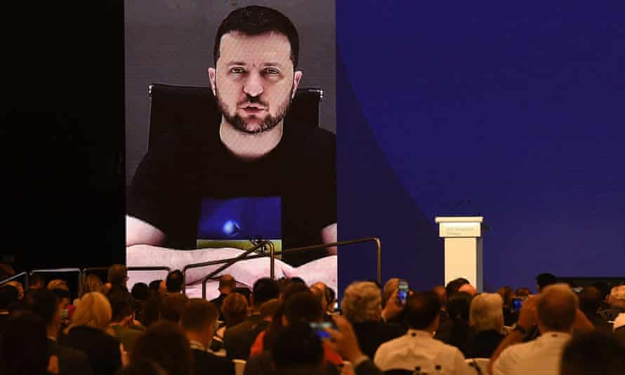Ukraine’s President Volodymyr Zelenskiy (on screen) addresses participants at the Shangri-La Dialogue summit virtually via a video link in Singapore.