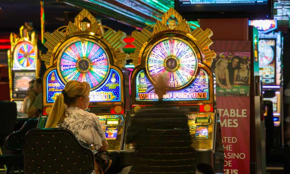 Gamblers playing slot machines in Las Vegas, Nevada, USA.