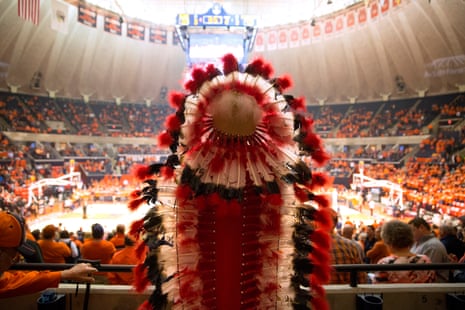 A student portrays Chief Illiniwek during halftime at a University of Illinois basketball game on 28 February 2016, in Champaign, Illinois.