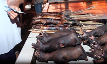 Traders selling bat meat at a market in Tomohon City, Indonesia.