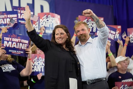 Platner and his wife, Amy Gertner, waving to supporters at the primary election night watch party.