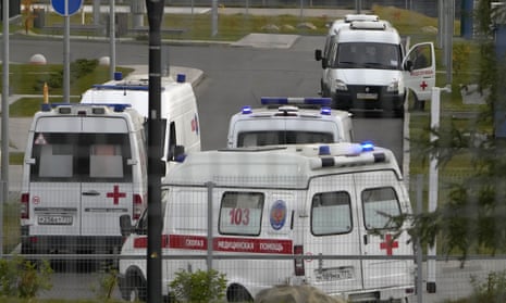 Ambulances wait to deliver patients suspected of having coronavirus to a hospital in Kommunarka, outside Moscow.