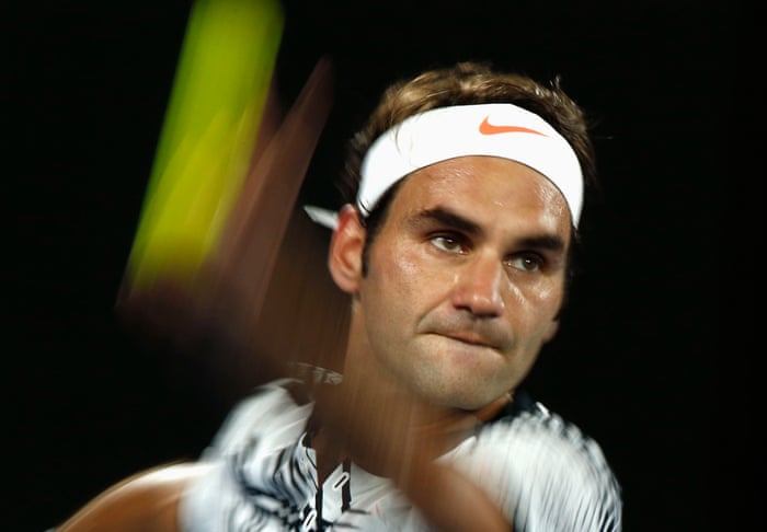 Roger Federer serves