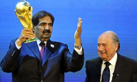 Sepp Blatter watches as the then-emir of Qatar, Sheikh Hamad bin Khalifa al-Thani, celebrates his nation winning the hosting rights in 2010.