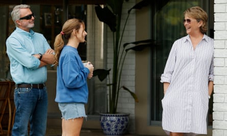 Sam Neill, Georgia Flood and Annette Bening talking outside a house in Apples Never Fall