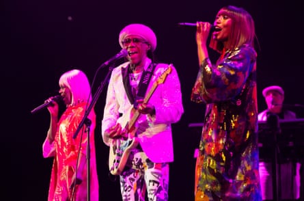Nile Rodgers with backing singers Kimberly Davis (left) and Folami.