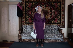 Photographs of Vera wearing clothes that tell her story by photographer Tatsiana Tkachova.