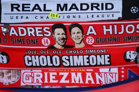A scarf featuring Atlético manager Diego Simeone and his son Giuliano Simeone