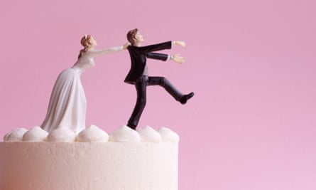 Bride and groom figurines on a wedding cake