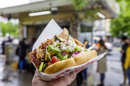 A kebab and salad in a soft roll