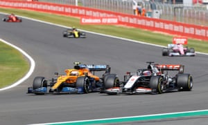 Norris takes Grosjean.