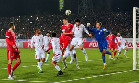 Russia (red shirts) play in a friendly against Tajikistan last November.