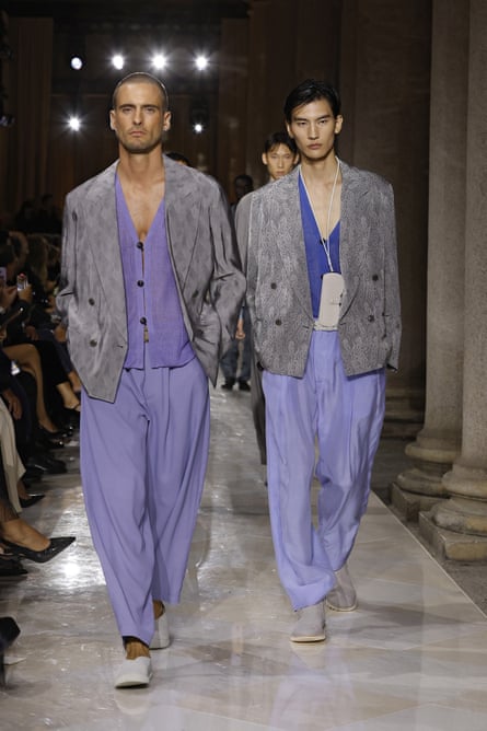 two male models in double-breasted, grey jackets with balloon trousers in purple