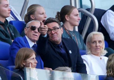 Andy Burnham in the stands with his wife Marie-France van Heel and former Everton player Peter Reid