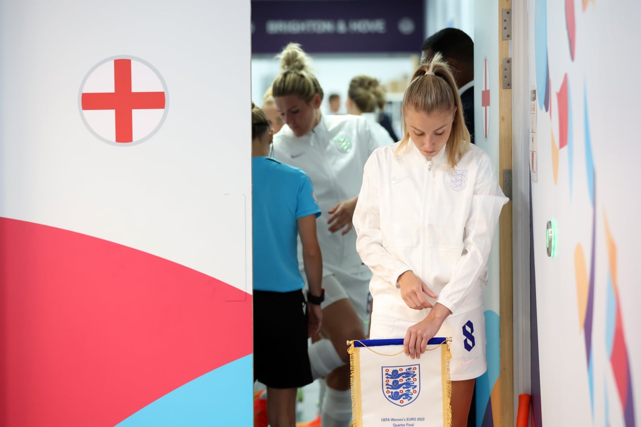 Leah Williamson of England prepares to lead her team onto the pitch for the quarter-final match against Spain.