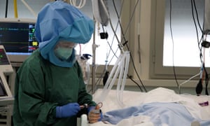 A coronavirus patient is cared for in hospital in Rome