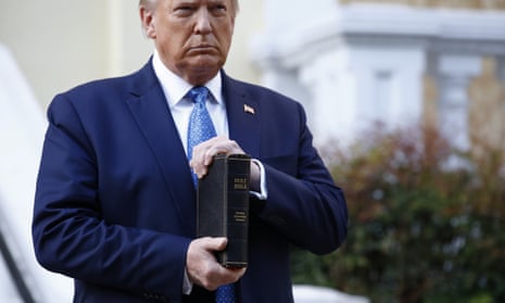 Donald Trump holds a Bible outside St John’s Church across Lafayette Park from the White House on Monday.