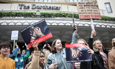 Protesters gather outside the Dorchester hotel in London.