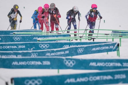 Athletes ski uphill through the ski mountaineering course during the women's race.