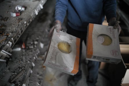 Man holding damaged goods in his shop