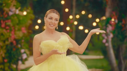 A woman wearing a lemon coloured ballgown