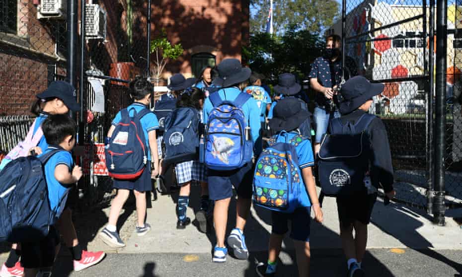 Students arrive to Carlton Gardens Primary school in Melbourne