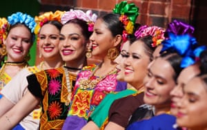 Middlesbrough, UK. A line of people wear traditional Mexican dress in the vein of Frida Kahlo