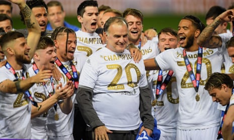 Marcelo Bielsa is the centre of attention as Leeds celebrate promotion to the Premier League in July.