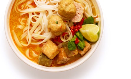 Ladle the broth over cooked rice noodles, top with the tofu, prawn balls and herbs, and serve with lime and chilli.