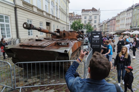 People look at displayed Russian military equipment that was destroyed in battles with the Ukrainian army in Lviv, Ukraine, on 12 August 2022.