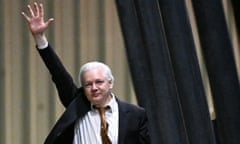 Julian Assange waves to supporters at Canberra airport