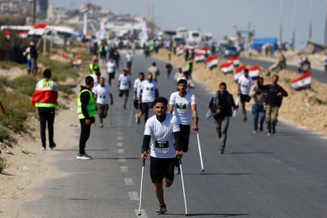 Men on crutches participate in the race in the central Gaza Strip.