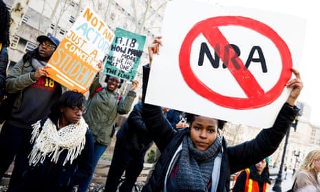 Students from area schools gather for a rally at Brooklyn Borough Hall to protest gun violence and to call on Congress to enact gun control measures in Brooklyn, New York, on 14 March.