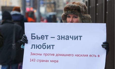 A lone woman protests in Moscow against the decriminalisation of domestic violence.