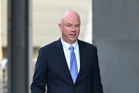 bald man wearing dark suit