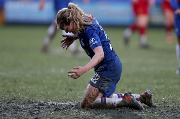 Chelsea’s Erin Cuthbert suffers in the mud at Prenton Park