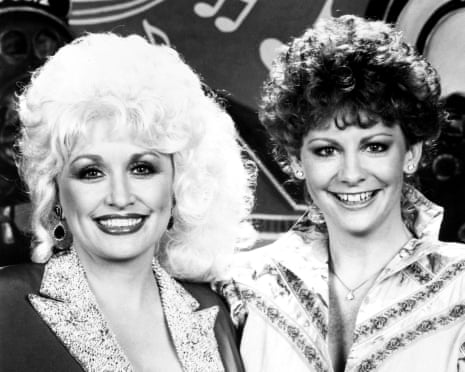 Dolly Parton and Reba McEntire in a television special celebrating the 60th anniversary of the Grand Ole Opry on 14 January 1986.