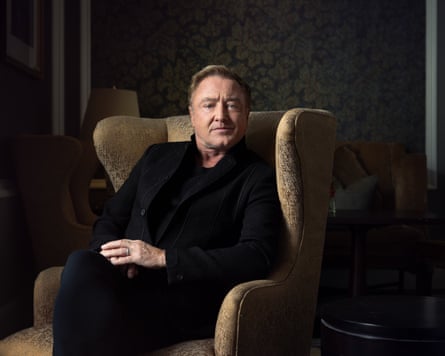 Flatley in an armchair